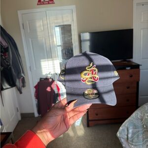 New Era Navy Hat with Yellow and Red Embroidered Logo